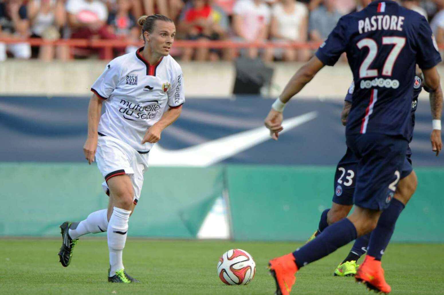 Nice's Swedish midfielder Niklas Hult (L) runs with the ball during the French friendly football match between Paris Saint-Germain (PSG) and Nice (OGCN), ahead of the L1 competition, on July 23, 2014, in Beziers, southern France. AFP PHOTO / SYLVAIN THOMAS (Photo credit should read SYLVAIN THOMAS/AFP/Getty Images)