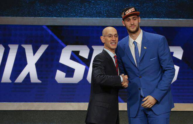 Georgios Papagiannis, right poses for a photo with NBA Commissioner Adam Silver after being selected 13th overall by the Phoenix Sunx during the NBA basketball draft, Thursday, June 23, 2016, in New York. (AP Photo/Frank Franklin II)