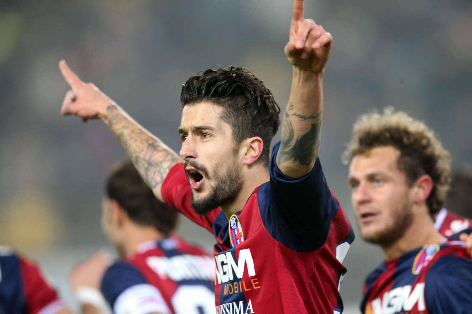 Bologna's Panagiotis Kone, of Greece, celebrates after scoring during the Italian Serie A soccer match between Bologna and Chievo at the Renato Dall' Ara stadium in Bologna, Italy, Saturday, Jan. 12, 2013. (AP Photo/Studio FN)