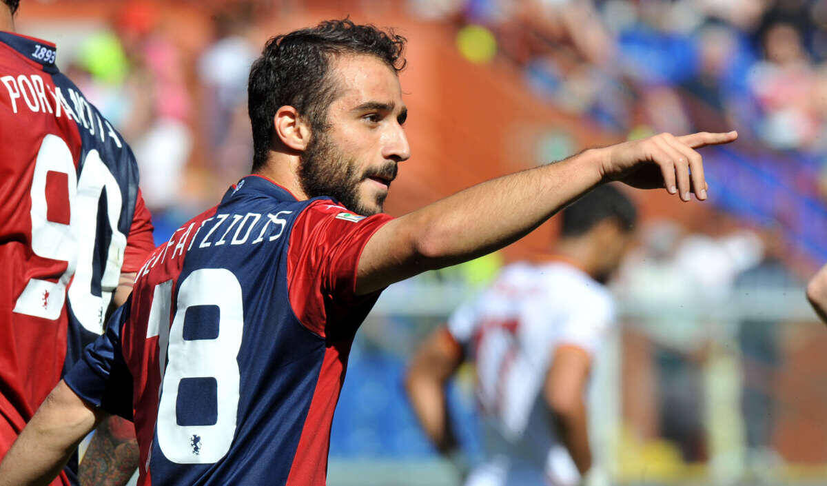 Genoa's Ioannis Fetfatzidis celebrates after scoring during a Serie A soccer match between Genoa and Roma, at Genoa's Luigi Ferraris Stadium, Italy, Sunday, May 18, 2014. (AP Photo/Tano Pecoraro)